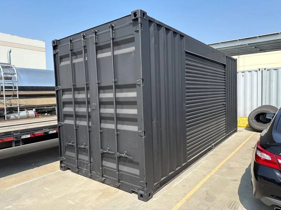 20ft Used Shipping Container – Matte Black w/ 12’ Side Roll-Up Door